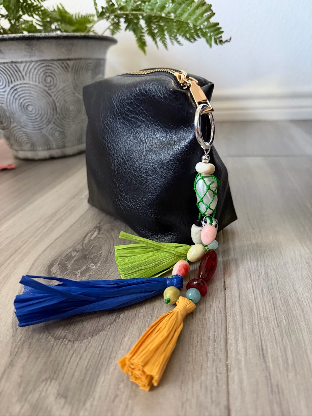 Black Leather Cosmetic Pouch with Colorful Tassel Charm